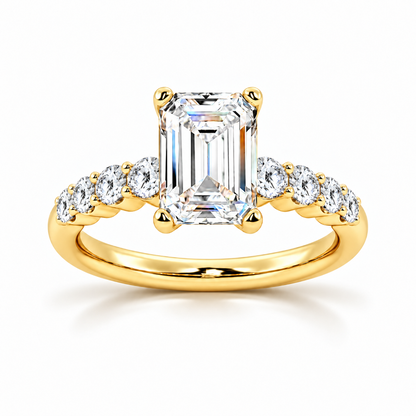 Yellow gold emerald cut moissanite engagement ring top view with shared-prong round side stones