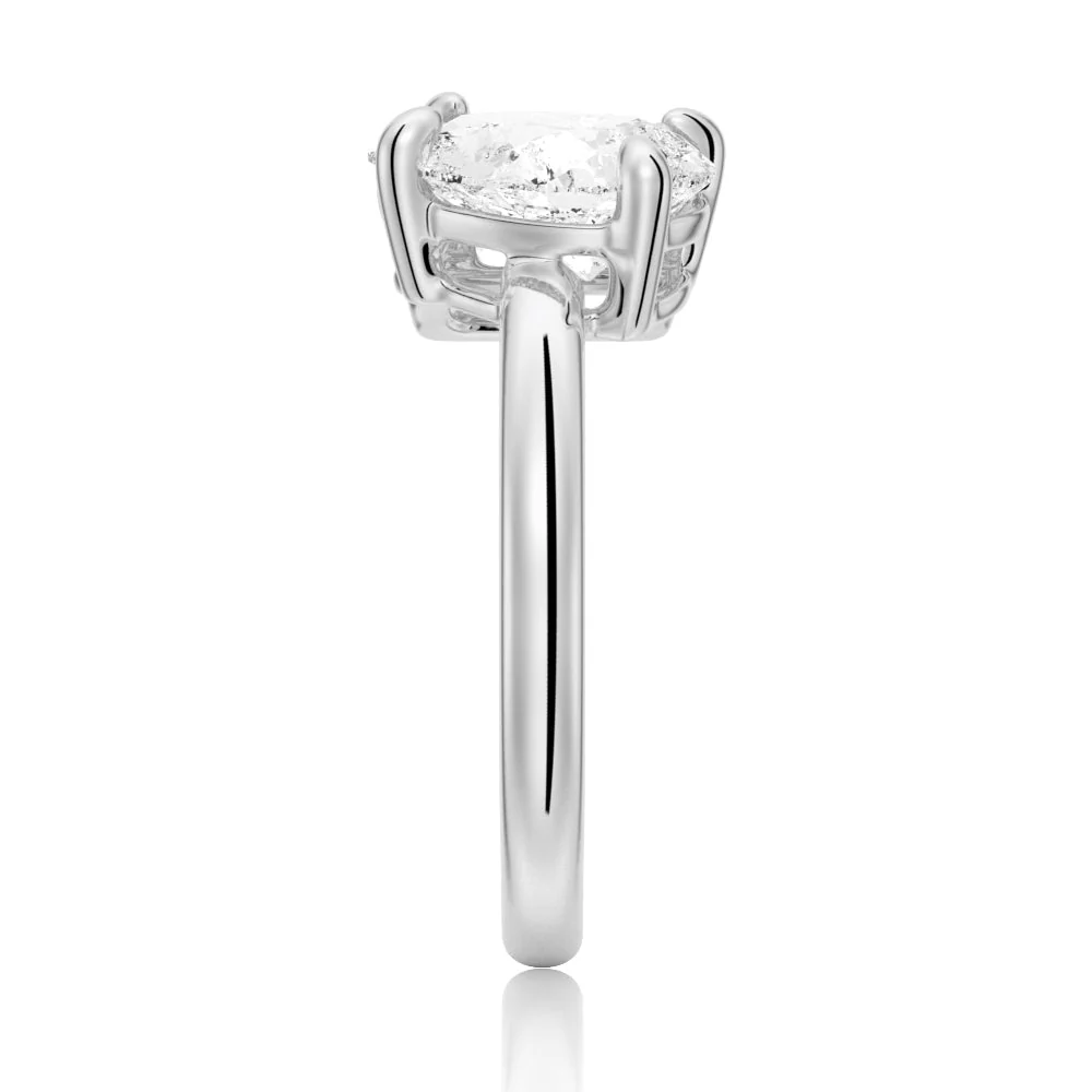 White gold emerald and pear cut toi et moi moissanite engagement ring direct side profile view