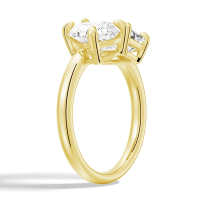 Yellow gold emerald and pear cut toi et moi moissanite engagement ring 3/4 perspective view showing prong settings