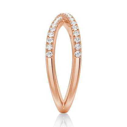 Edge view showing French pave moissanite crossover band structure in yellow gold color