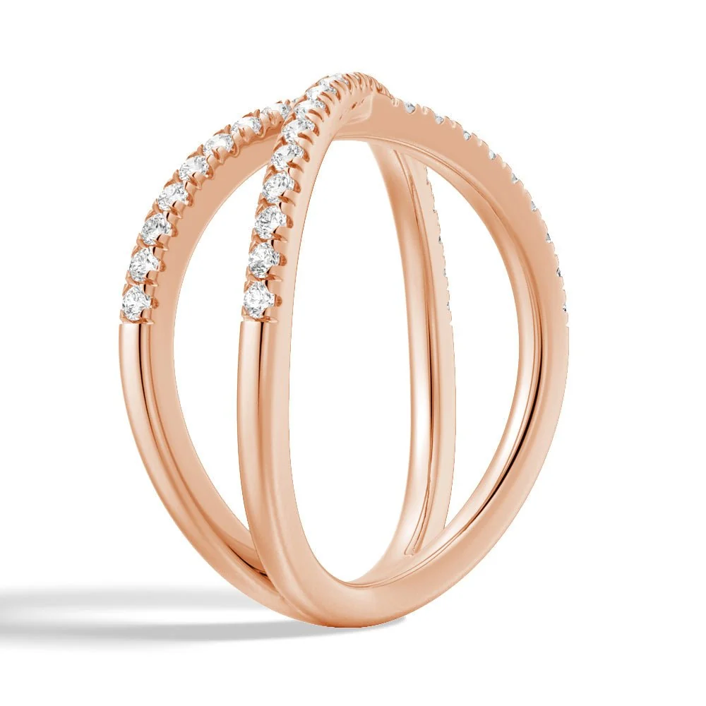 Three-quarter perspective view of French pave moissanite crossover ring in rose gold color