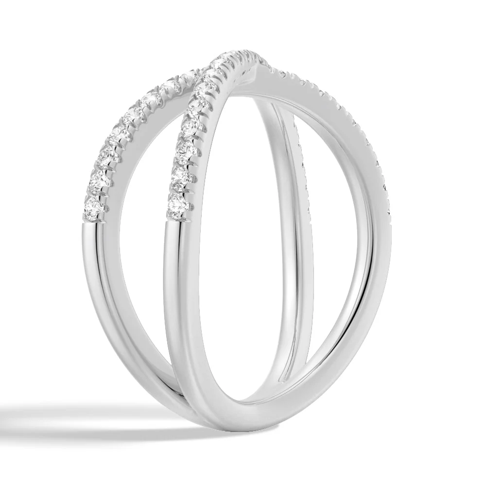 Three-quarter perspective view of French pave moissanite crossover ring in white gold color