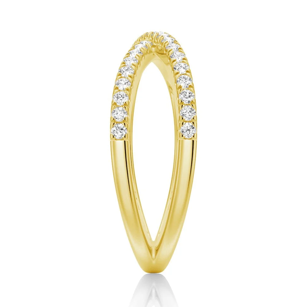 Edge view showing French pave moissanite crossover band structure in yellow gold color