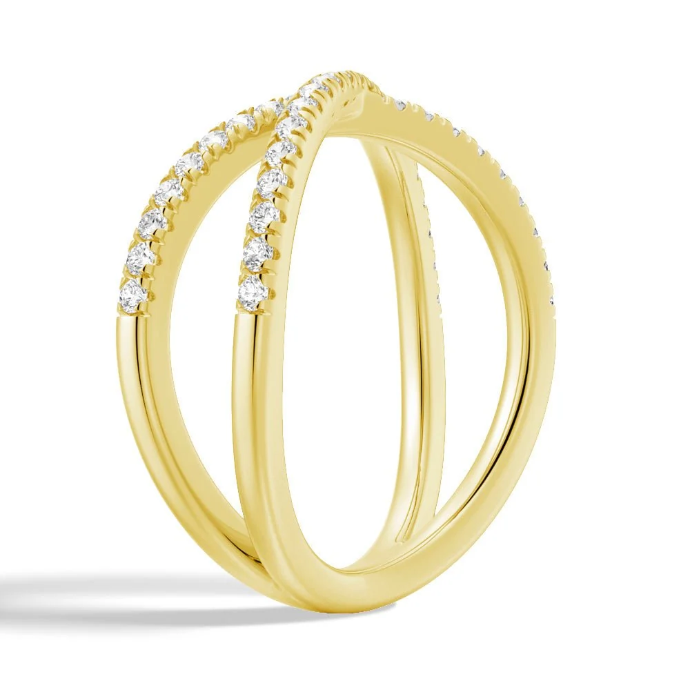 Three-quarter perspective view of French pave moissanite crossover ring in yellow gold color
