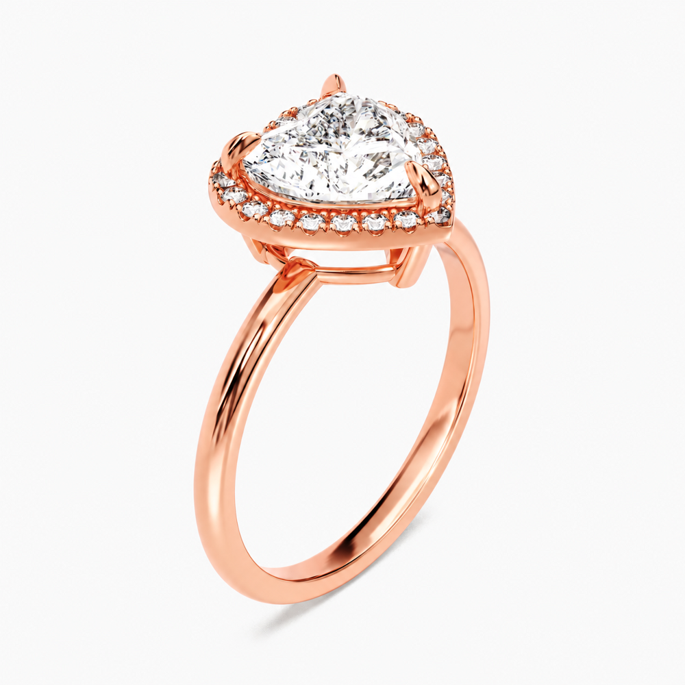 Rose gold heart shaped moissanite halo engagement ring 3/4 side low angle perspective view showing basket