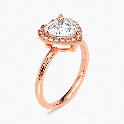 Rose gold heart shaped moissanite halo engagement ring 3/4 side low angle perspective view showing basket