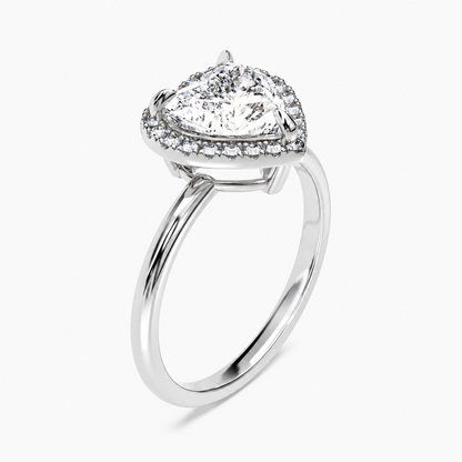 White gold heart shaped moissanite halo engagement ring 3/4 side low angle perspective view showing basket