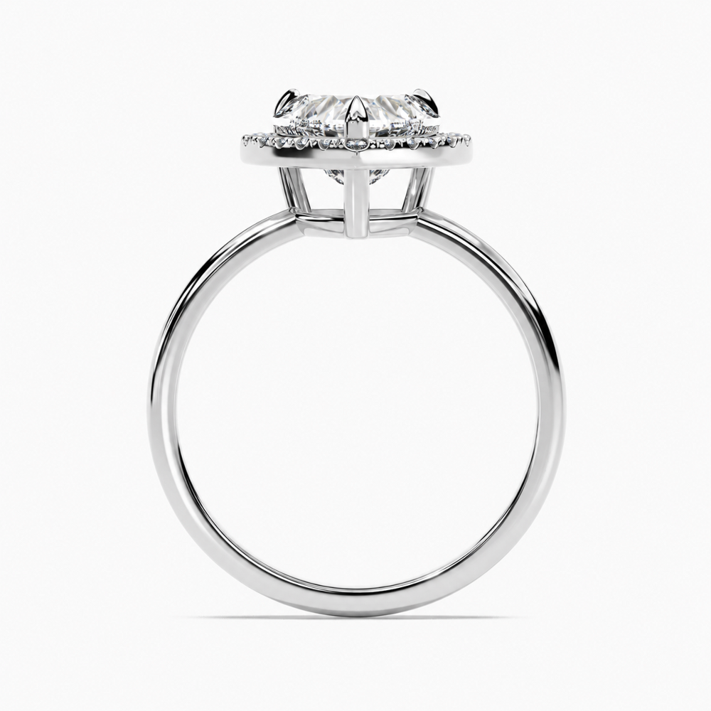 White gold heart shaped moissanite halo engagement ring direct side profile view showing halo platform