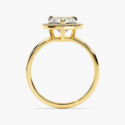 Yellow gold heart shaped moissanite halo engagement ring direct side profile view showing halo platform
