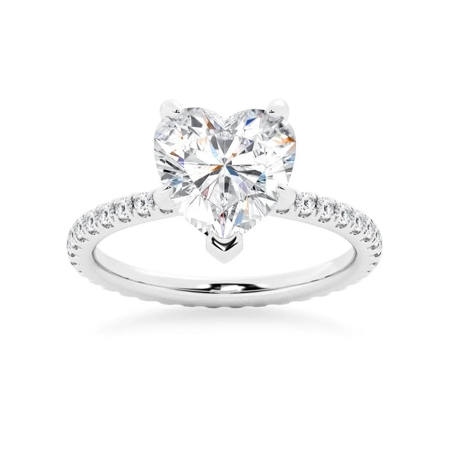 White gold heart shaped moissanite engagement ring side profile perspective view showing three prong basket-Novelle Vow
