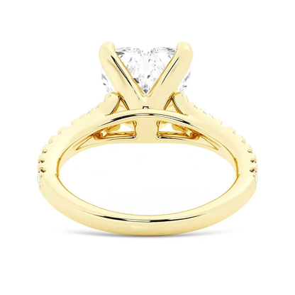 Yellow gold heart shaped moissanite engagement ring side profile view showing split shank basket
