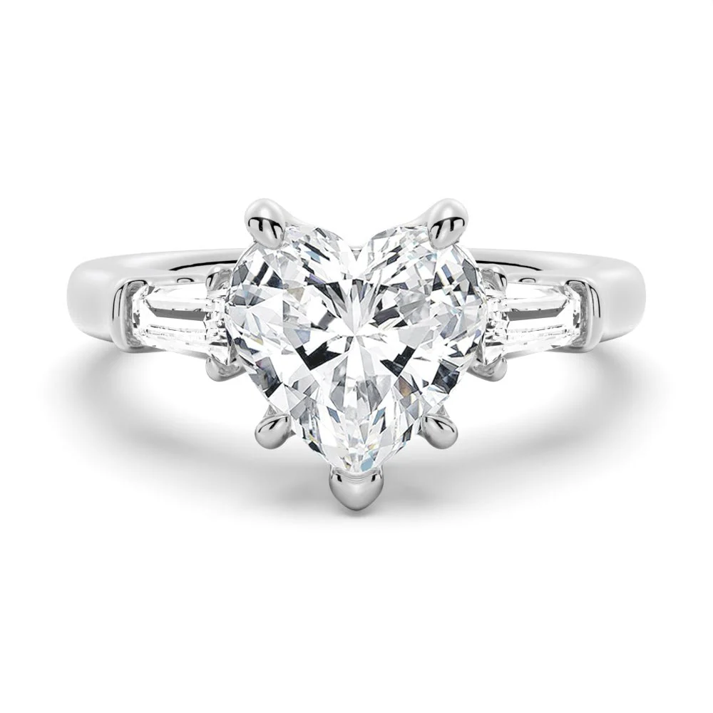 White gold heart shaped moissanite engagement ring top view with tapered baguette side stones-Novelle Vow
