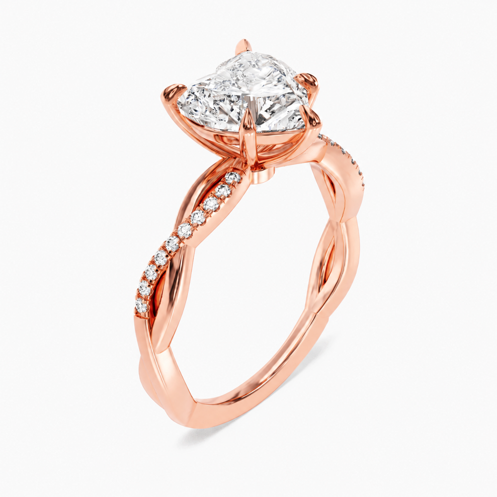 Rose gold heart shaped moissanite engagement ring 3/4 side low angle perspective view showing basket