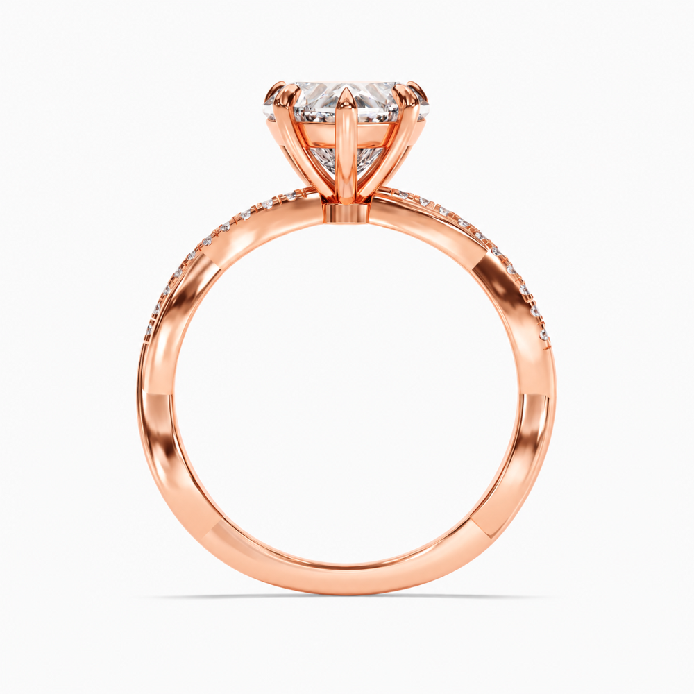 Rose gold heart shaped moissanite engagement ring top view with twisted pave moissanite band