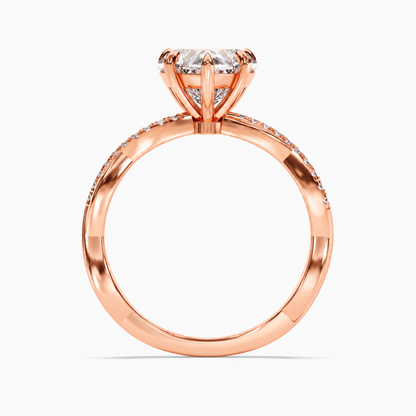 Rose gold heart shaped moissanite engagement ring top view with twisted pave moissanite band