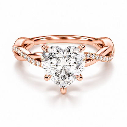 Rose gold heart shaped moissanite engagement ring top view with twisted pave moissanite band