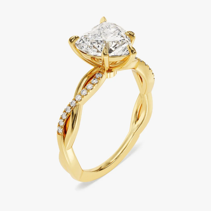 Yellow gold heart shaped moissanite engagement ring 3/4 side low angle perspective view showing basket