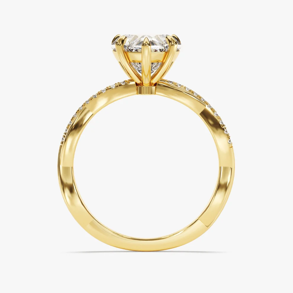 Yellow gold heart shaped moissanite engagement ring top view with twisted pave moissanite band