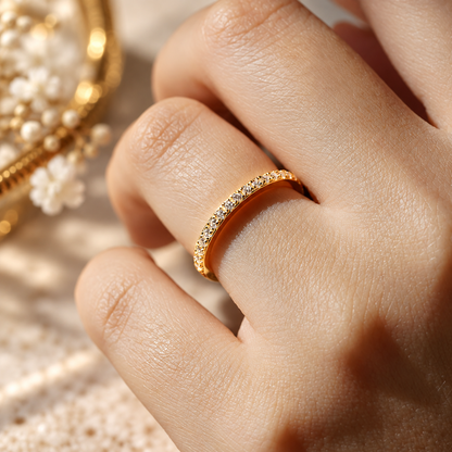 On-hand view of 0.15ct TW classic round pave moissanite anniversary band worn on finger