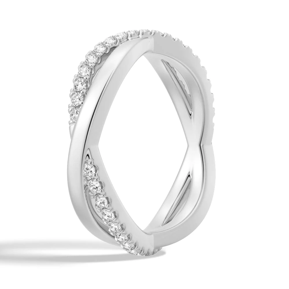 Three-quarter perspective view of infinity intertwining pave moissanite ring in white gold