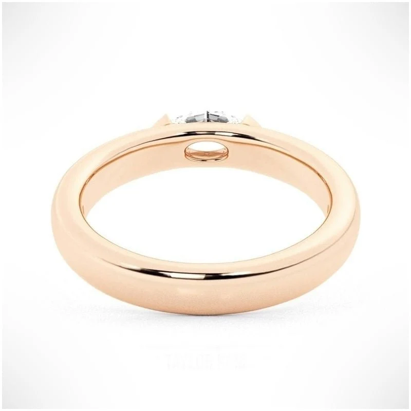 Rose gold marquise cut moissanite east-west half bezel solitaire ring direct side profile view showing smooth band