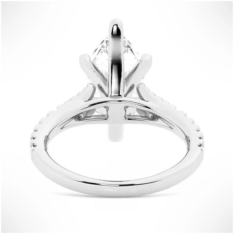 White gold marquise cut moissanite engagement ring direct side profile view showing cathedral bridge