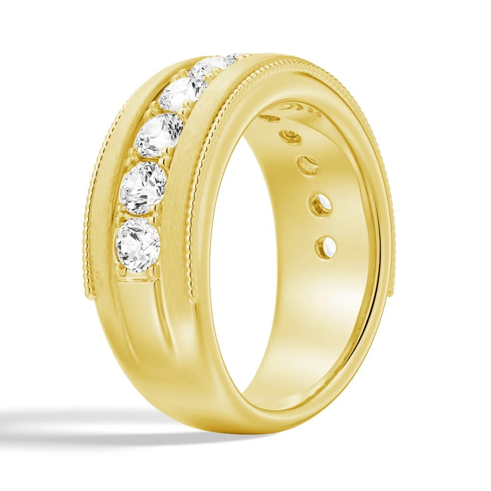 Three-quarter perspective view of men's 9mm moissanite wedding ring with milgrain details in yellow gold color