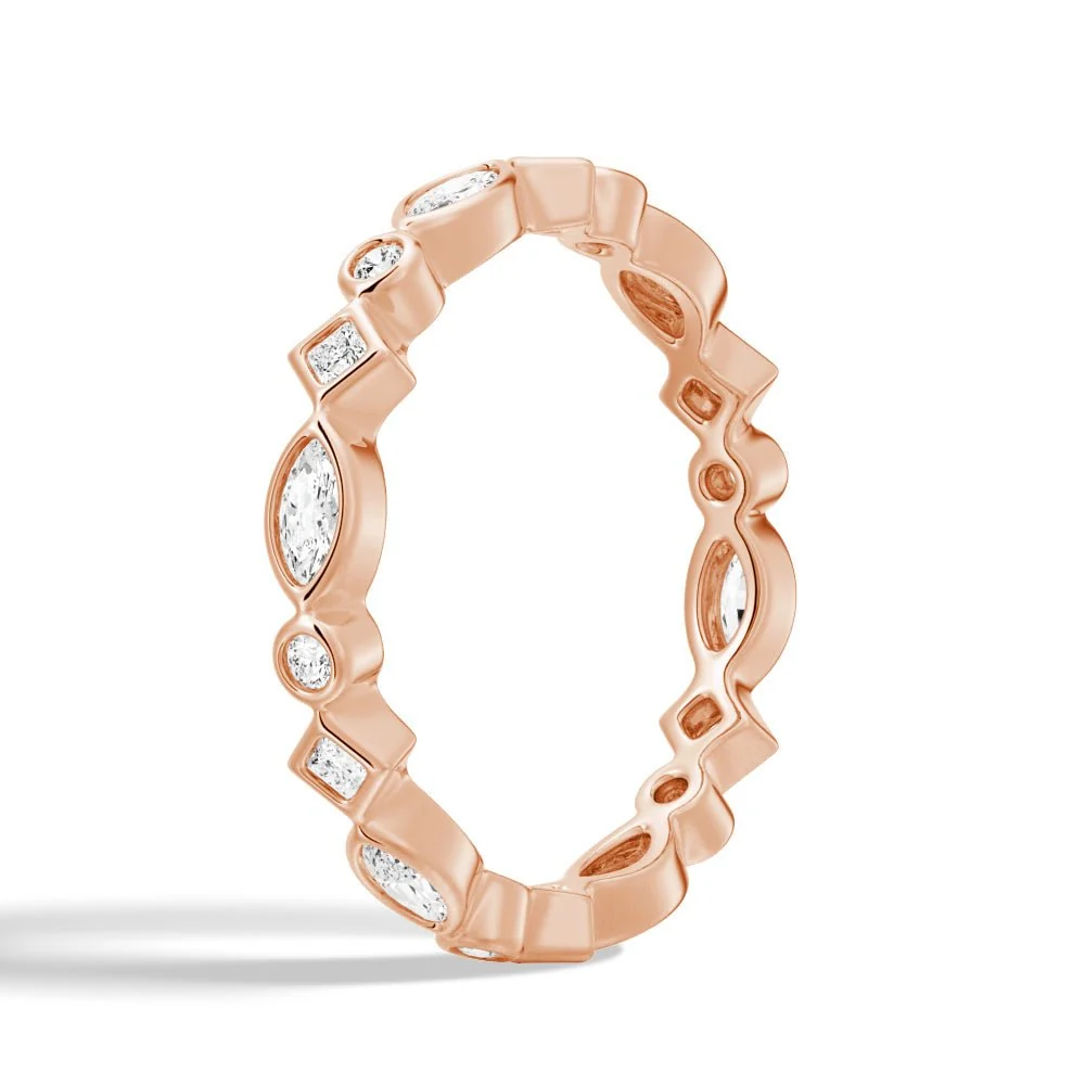 Three-quarter perspective view of multi-shape bezel moissanite wedding band in rose gold color
