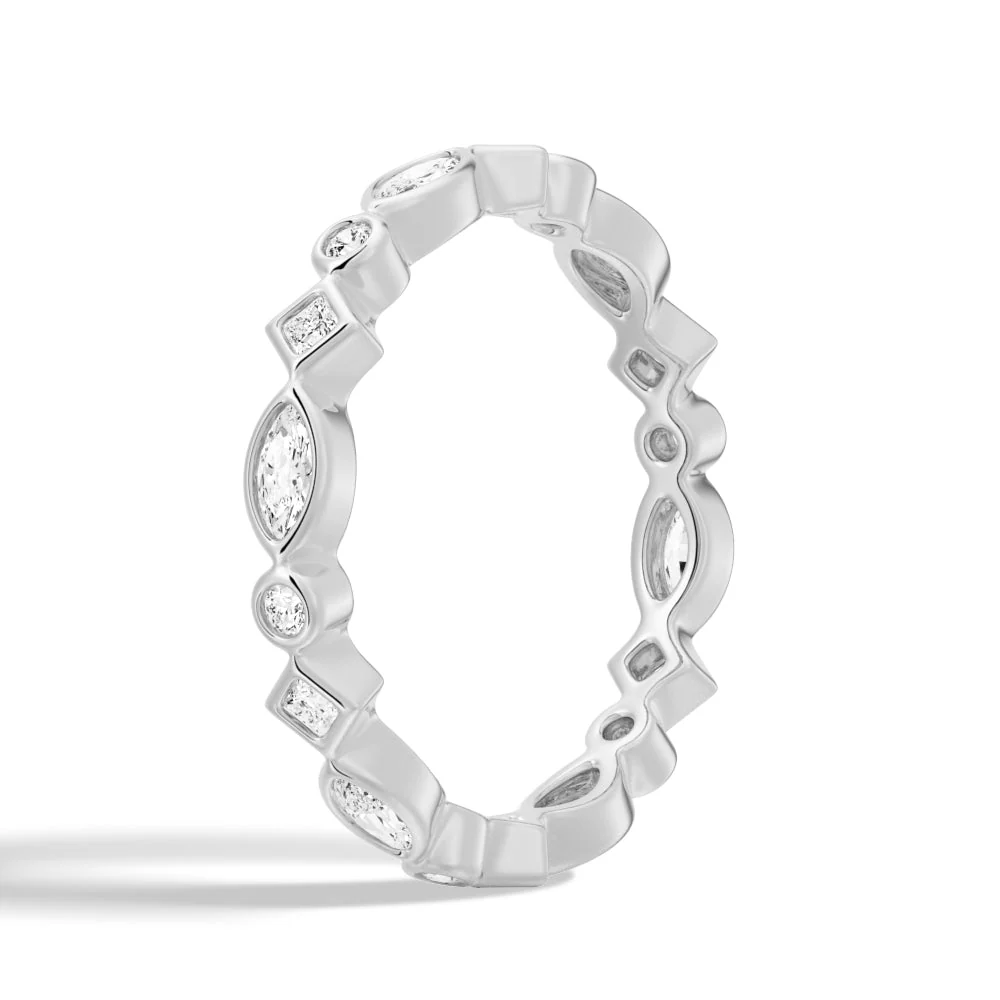 Three-quarter perspective view of multi-shape bezel moissanite wedding band in yellow gold color