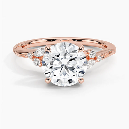 Front view of rose gold round moissanite solitaire ring with marquise and round side accents
