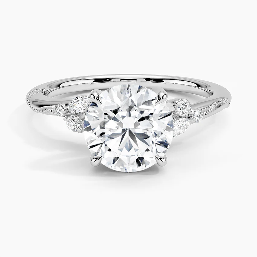 NOVELLE VOW front view of nature inspired round moissanite engagement ring with marquise accents in white gold