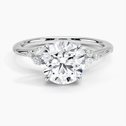 NOVELLE VOW front view of nature inspired round moissanite engagement ring with marquise accents in white gold