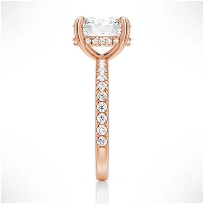 Side profile view of Oval Cut Moissanite Engagement Ring with Hidden Halo & Pavé Band and 4 Prong Setting in Rose Gold