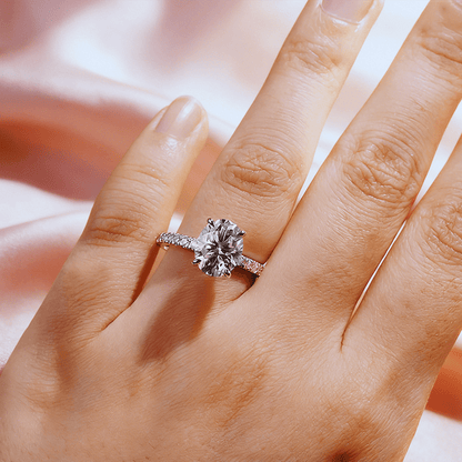 Oval Cut Moissanite Engagement Ring with Hidden Halo & Pavé Band and 4 Prong Setting in White Gold on hand styling - Novelle Vow