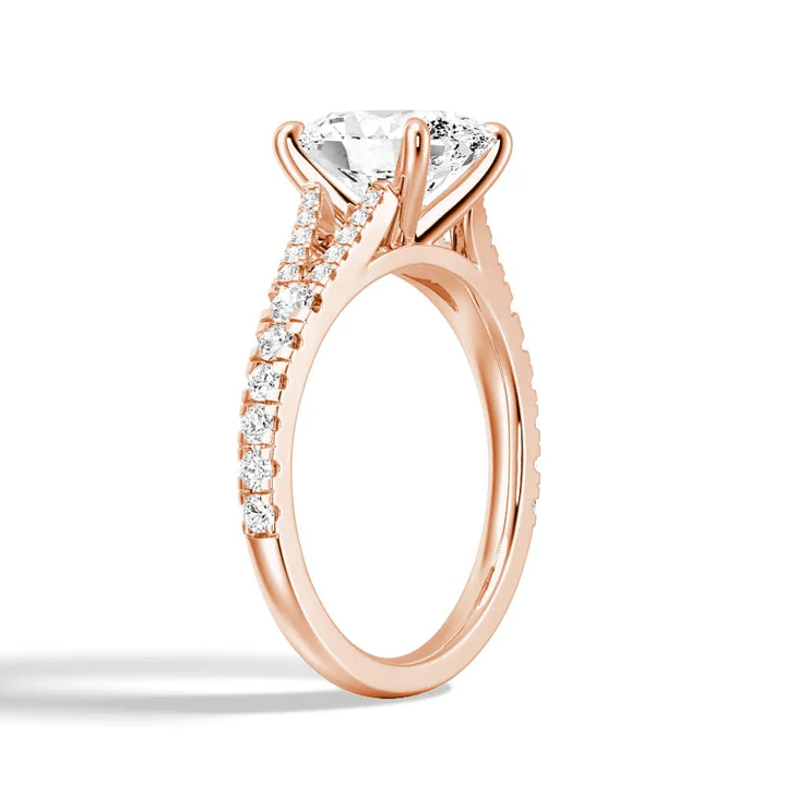 Angled profile view of Oval Cut Moissanite Engagement Ring with Split Pavé Band in Rose Gold - Novelle Vow