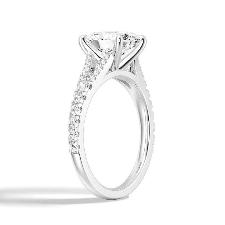 Angled profile view of Oval Cut Moissanite Engagement Ring with Split Pavé Band in White Gold - Novelle Vow