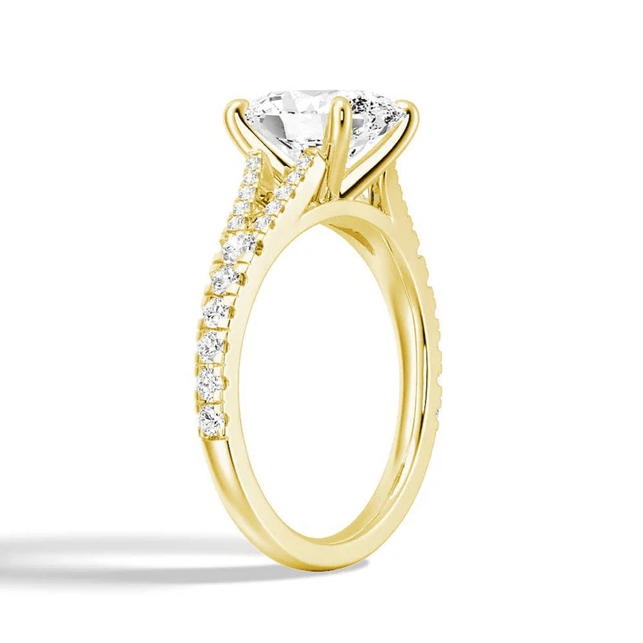 Angled profile view of Oval Cut Moissanite Engagement Ring with Split Pavé Band in Yellow Gold - Novelle Vow