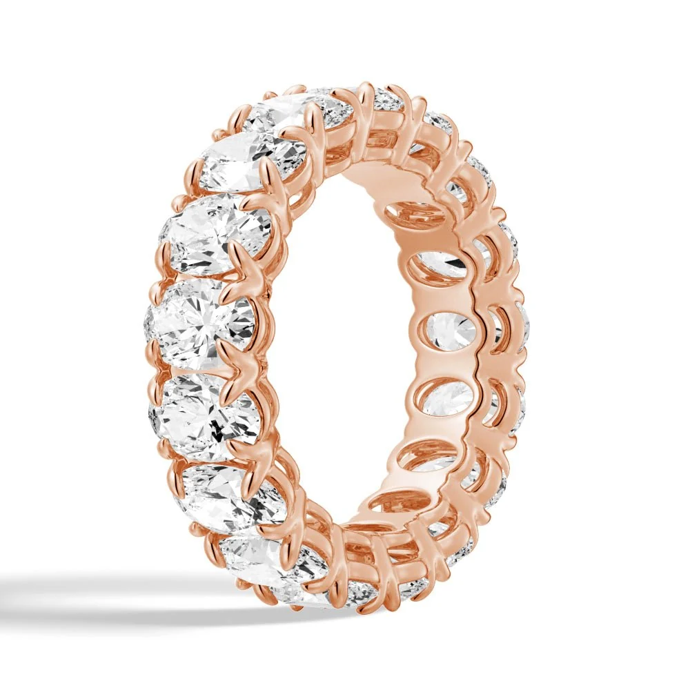 Three quarter view of rose gold oval cut moissanite full eternity ring