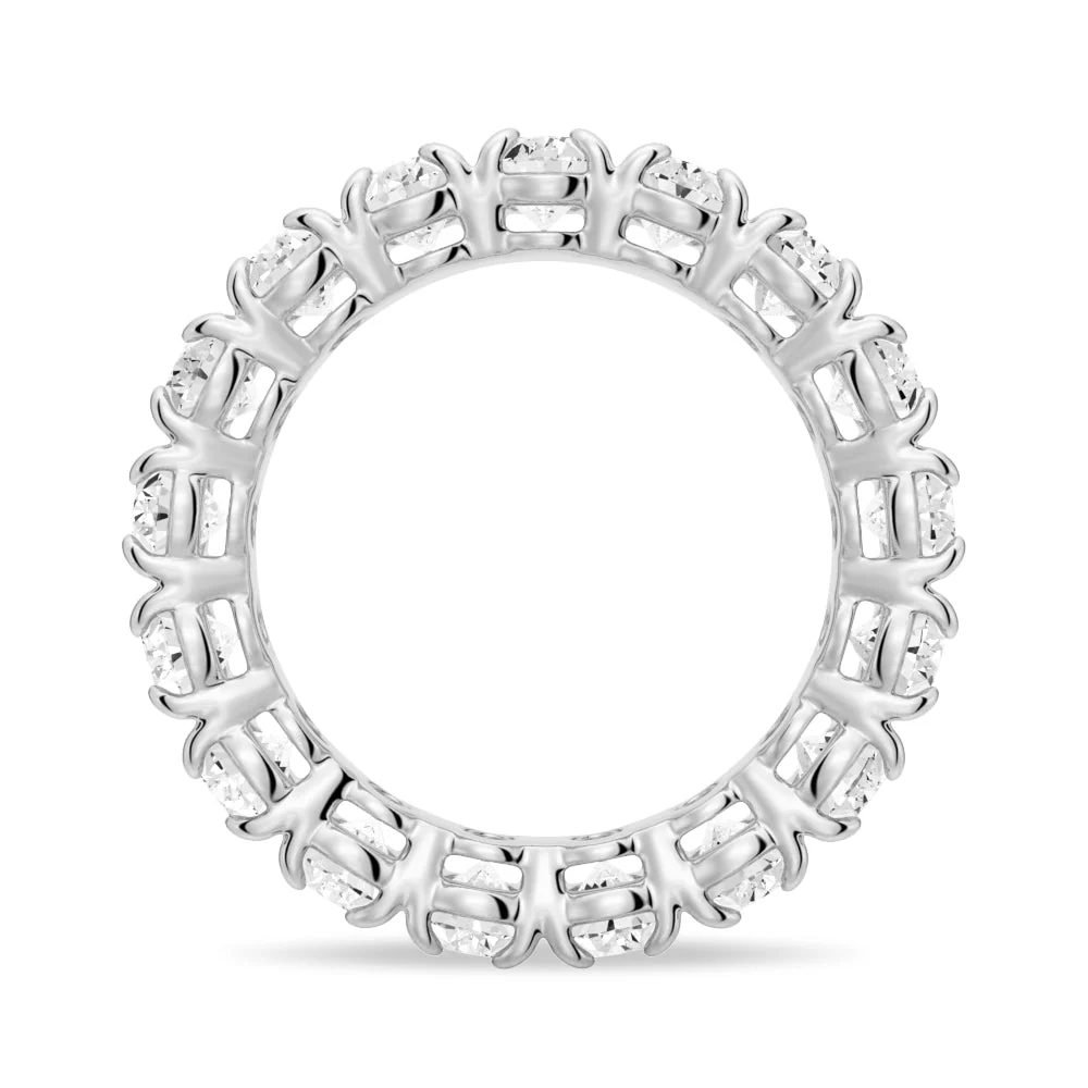 Side circular profile view of white gold oval cut moissanite ring