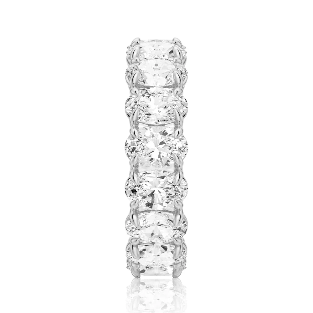 Vertical top view of white gold oval cut moissanite eternity band