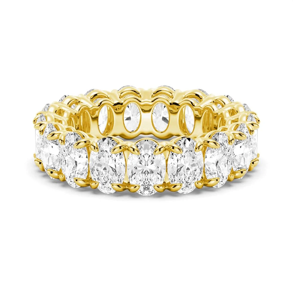 Front view of yellow gold oval cut moissanite eternity ring