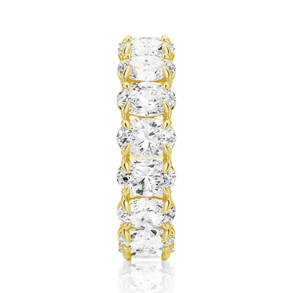 Vertical top view of yellow gold oval moissanite eternity band