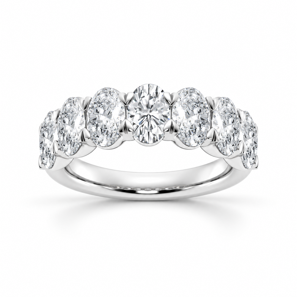 NOVELLE VOW front view of white gold oval cut moissanite seven stone wedding band
