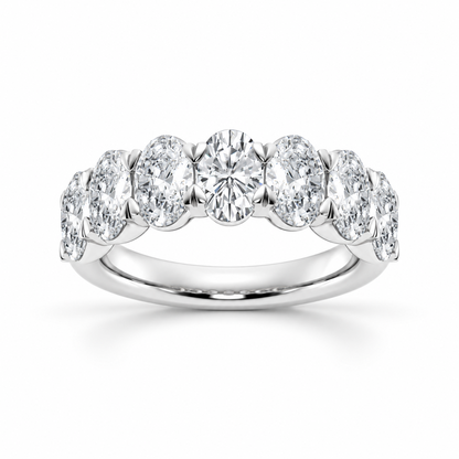 NOVELLE VOW front view of white gold oval cut moissanite seven stone wedding band