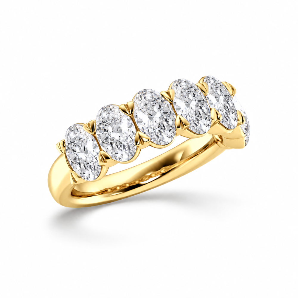 Front view of yellow gold oval cut moissanite seven stone ring