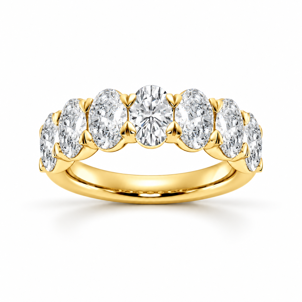 Front view of yellow gold oval cut moissanite seven stone ring