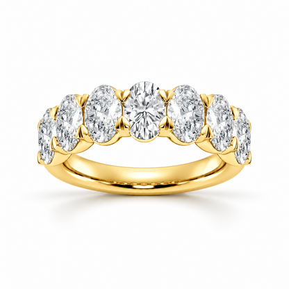Front view of yellow gold oval cut moissanite seven stone ring