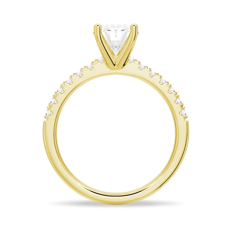 Profile view of Petite Oval Moissanite Engagement Ring with Micropavé Band in Yellow Gold
