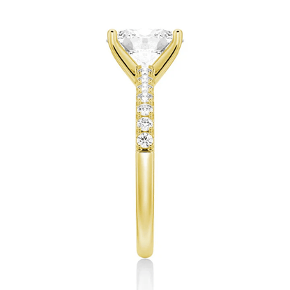 Side profile view of Petite Oval Moissanite Engagement Ring with Micropavé Band in Yellow Gold