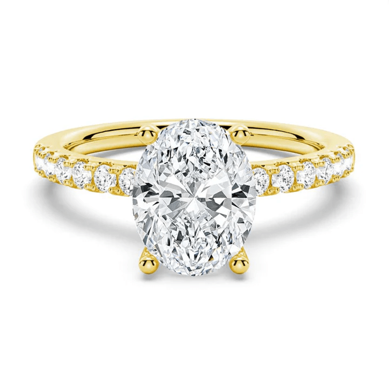 Petite Oval Moissanite Engagement Ring with Micropavé Band in Yellow Gold 